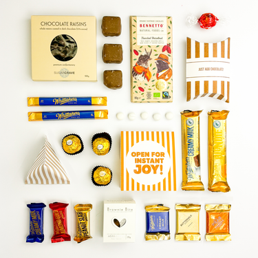 Assorted chocolate bars and packaging on a white background