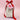 White drawstring bag with red ribbon and pink tag on a pink background