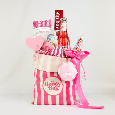 Flutter and Fizz gift bag filled with sweets and treats.