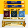 Whittaker's chocolate bars and packets on a yellow and white background