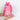 Pink and white striped 'Goody Bag' with a pink ribbon held by a person against a white background